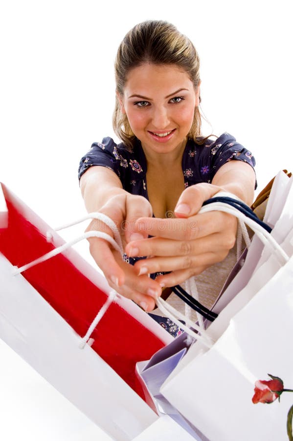 Standing woman showing shopping bags