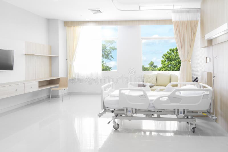 Stanza di ospedale con i letti e medico comodo fornita di Na
