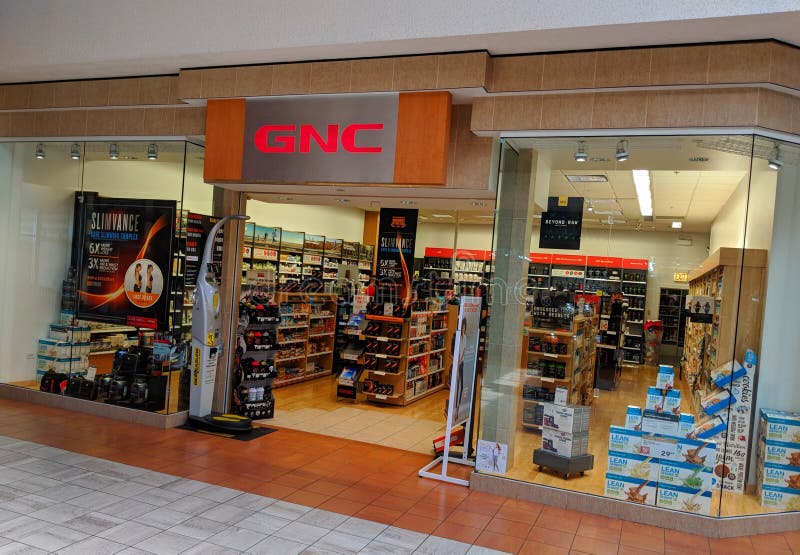 Stanza frontale di negozio del centro commerciale di GNC fotografia stock libera da diritti Stanza frontale di negozio del centro commerciale di GNC fotografia stock libera da diritti