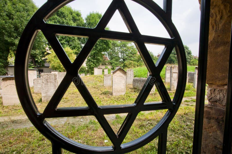 Star of David simbol on the fence of the old Jewish cemetery in the polish city