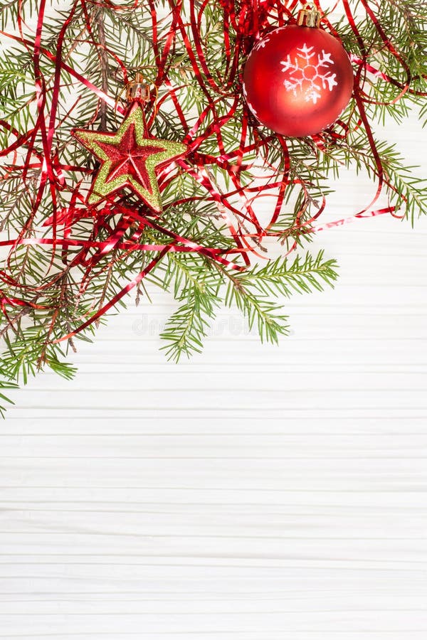 Star and red Xmas bauble and twig on blank paper. Christmas greeting card - border from star and red Xmas bauble and tree branch on blank paper background royalty free stock photo Star and red Xmas bauble and twig on blank paper. Christmas greeting card - border from star and red Xmas bauble and tree branch on blank paper background royalty free stock photo