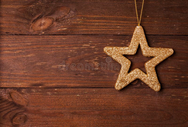 Star shape on wooden background royalty free stock image