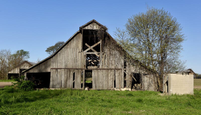 This is a Spring picture of a old deteriorating barn located in Sikeston, Missouri in Scott County. This picture was taken on April 6, 2017. This is a Spring picture of a old deteriorating barn located in Sikeston, Missouri in Scott County. This picture was taken on April 6, 2017.