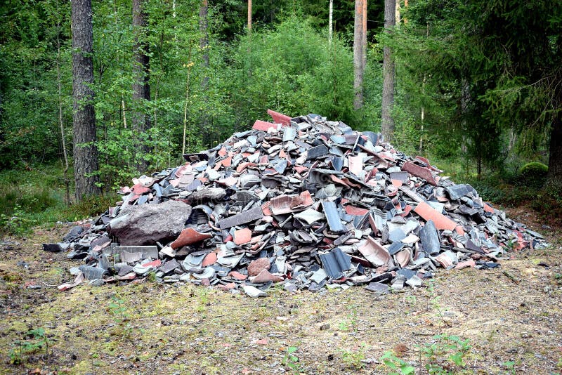 Pile of broken tiles with forest background. Pile of broken tiles with forest background.