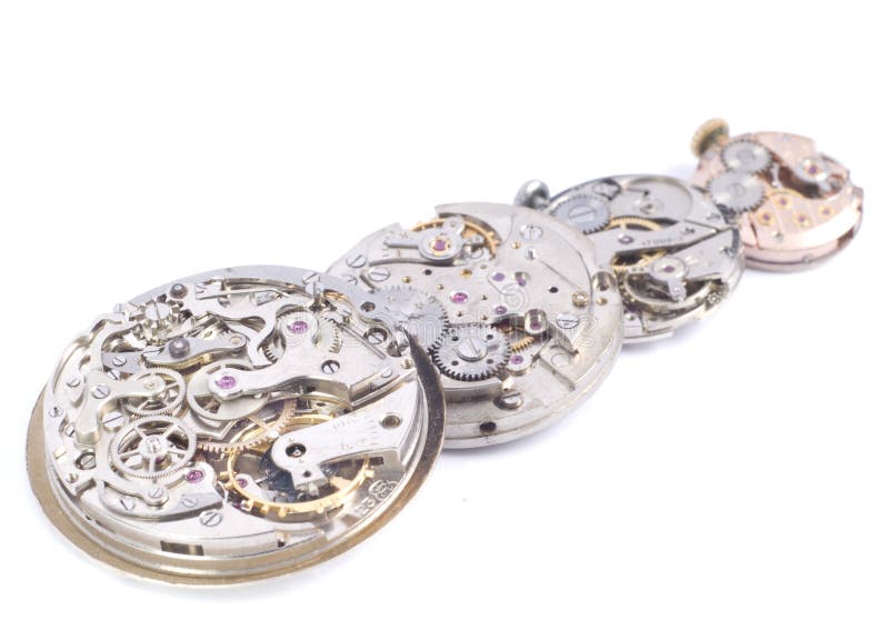 Detailed view of four watches mechanism in the row on the white background. Detailed view of four watches mechanism in the row on the white background