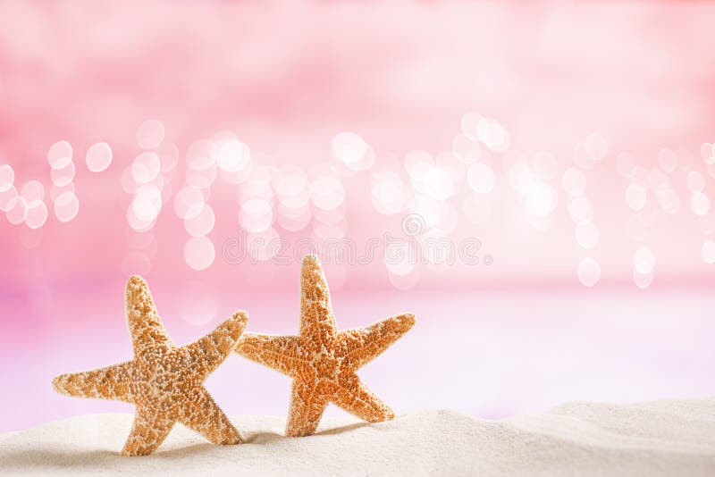 Starfish on white sand with festive glitter background