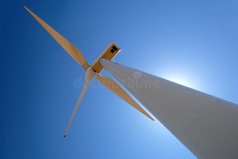 Power generating wind turbine against sun and blue sky, Rio Vista California. Power generating wind turbine against sun and blue sky, Rio Vista California.