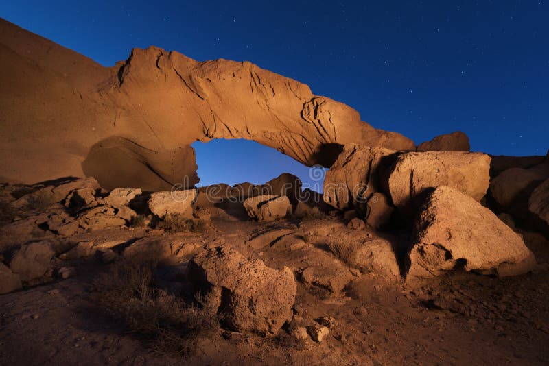 Starry night landscape of a volcanic Rock arch in Tenerife, Canary island, Spain.