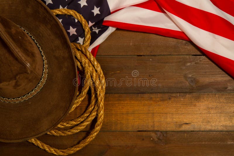 Stars striped united states flag cowboy classic wide brim hat and lasso. Stars striped united states flag cowboy classic wide brim hat and lasso