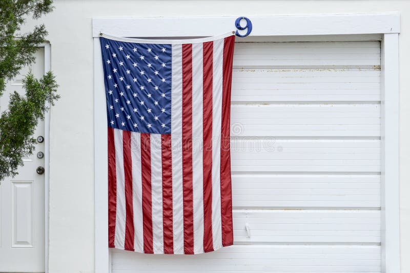 American flag hanging on a garage door