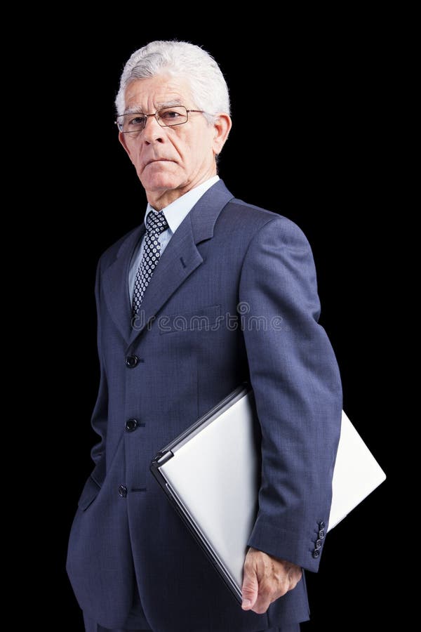 Starszy biznesmen trzyma laptop zdjęcia stock Starszy biznesmen trzyma laptop zdjęcia stock