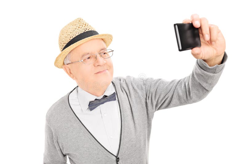 Starszy dżentelmen bierze selfie z telefonem komórkowym fotografia royalty free Starszy dżentelmen bierze selfie z telefonem komórkowym fotografia royalty free