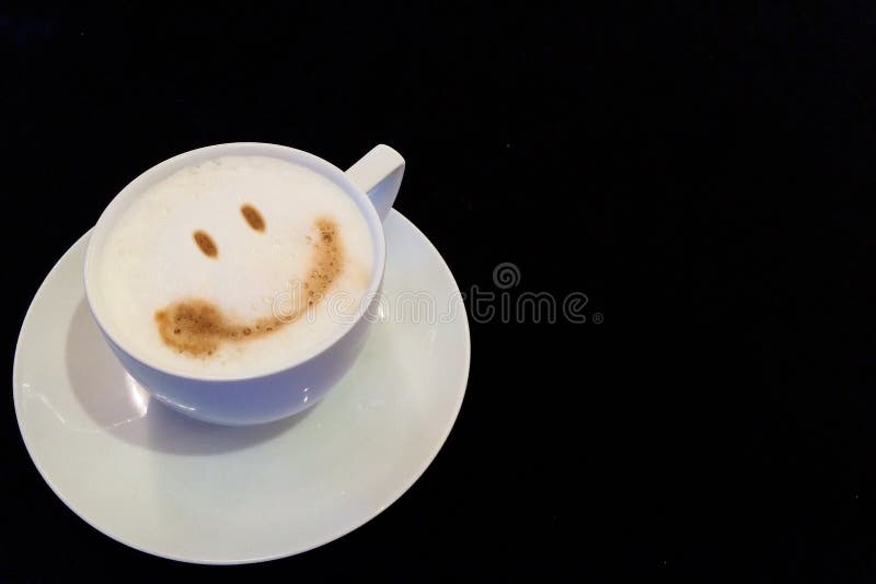 Start The Big Day with Smile Concept, Cup of Coffee with Smile Face at The Corner with Copyspace to input Text used as Template