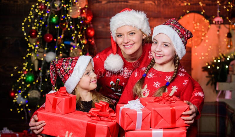 The start of the new year. Mother and daughters on Christmas day. Mother and children with Christmas gifts. Happy family royalty free stock photography The start of the new year. Mother and daughters on Christmas day. Mother and children with Christmas gifts. Happy family royalty free stock photography