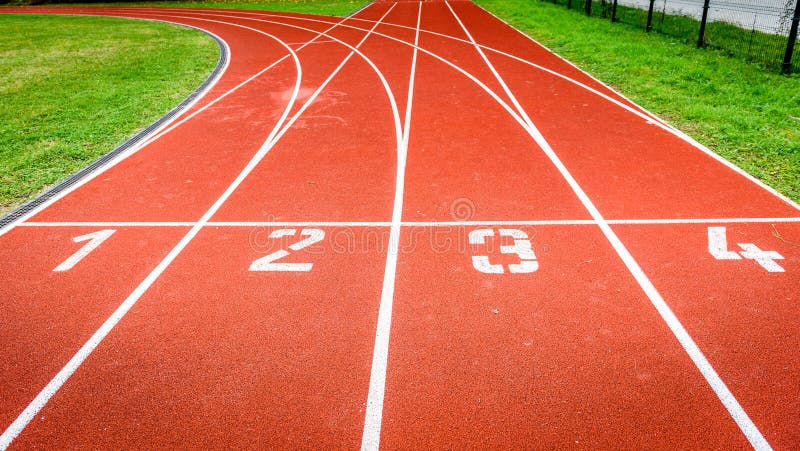 Start numbers on athletic running track in stadium.