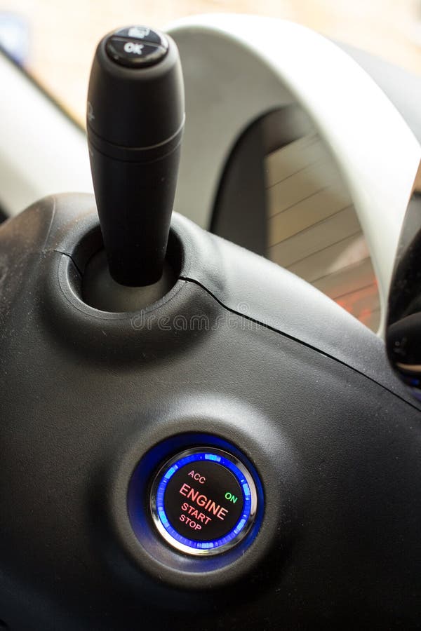 Start Stop Key into the Lock of Ignition of the Car. Stock Photo