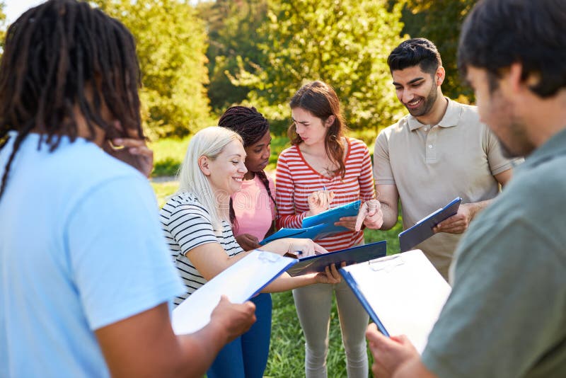 Startup Team with Clipboards during a Terrain Game Stock Photo Image