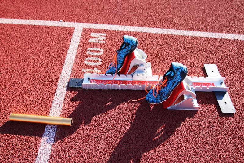 Starting Blocks at the 400m Start on a Red Track Stock Photo Image of