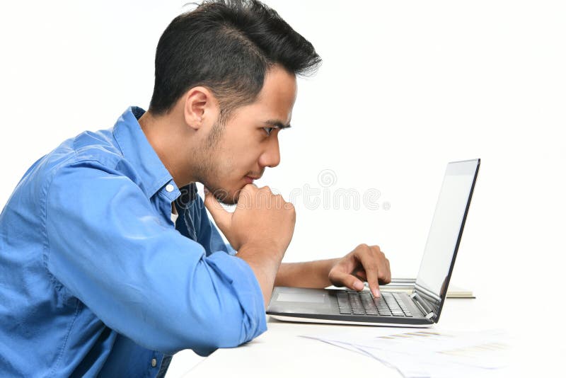 Startup business man sitting in relaxed posture while working with laptop computer