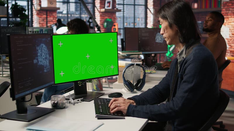 Startup IT expert uses AI to streamline coding process on green screen PC stock footage