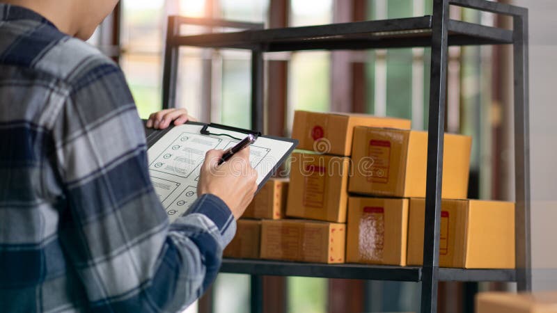 Startup or small business entrepreneur,Check sales and check business growth reports,order management in online stores,shopping on royalty free stock photo