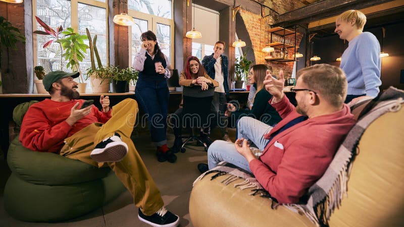 Startup team chatting together during office break. royalty free stock images