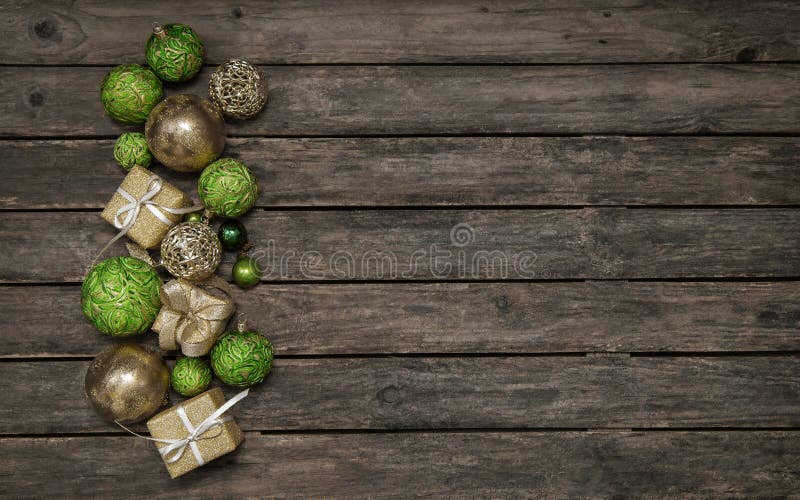 Rustic wooden background with christmas decoration in apple green and golden balls. Rustic wooden background with christmas decoration in apple green and golden balls.