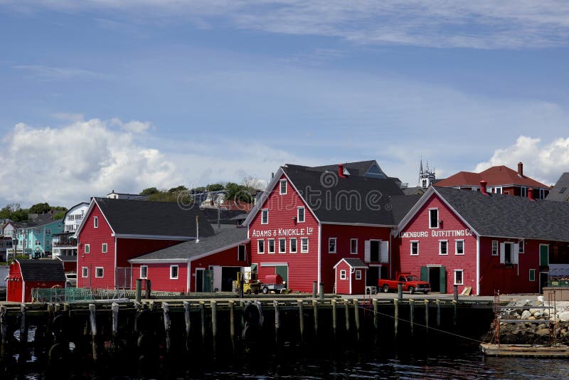 The iconic red buildings on the wharf in Lunenburg are designated as part of a UNESCO World Heritage Site. Old Town Lunenburg is the best surviving example of a planned British colonial settlement in North America. Established in 1753, it has retained its original layout and overall appearance, based on a rectangular grid pattern drawn up in the home country. The inhabitants have safeguarded the townâ€™s identity throughout the centuries by preserving the wooden architecture of the houses and public buildings, some of which date from the 18th century and which constitute an excellent example of a sustained vernacular architectural tradition. Its economic basis has traditionally been the offshore Atlantic fishery. The iconic red buildings on the wharf in Lunenburg are designated as part of a UNESCO World Heritage Site. Old Town Lunenburg is the best surviving example of a planned British colonial settlement in North America. Established in 1753, it has retained its original layout and overall appearance, based on a rectangular grid pattern drawn up in the home country. The inhabitants have safeguarded the townâ€™s identity throughout the centuries by preserving the wooden architecture of the houses and public buildings, some of which date from the 18th century and which constitute an excellent example of a sustained vernacular architectural tradition. Its economic basis has traditionally been the offshore Atlantic fishery.