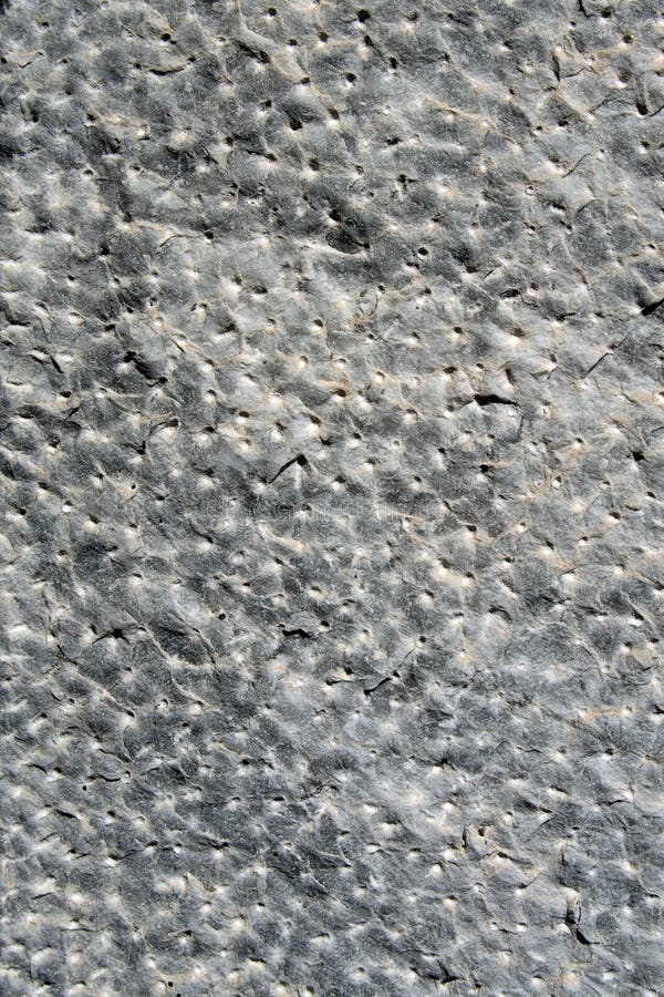 Close up of hand-hammered ancient stone floor (italian castle in La Spezia), gray rock, perfect for a background. Close up of hand-hammered ancient stone floor (italian castle in La Spezia), gray rock, perfect for a background