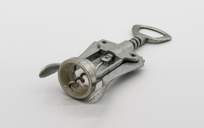Stary ośniedziały corkscrew na bielu zdjęcie royalty free Stary ośniedziały corkscrew na bielu zdjęcie royalty free