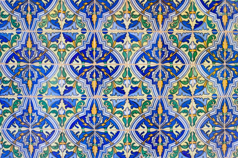 Old, historic tiled wall background in Real Alcazar, Seville, Spain, Andalusia region. Old, historic tiled wall background in Real Alcazar, Seville, Spain, Andalusia region.