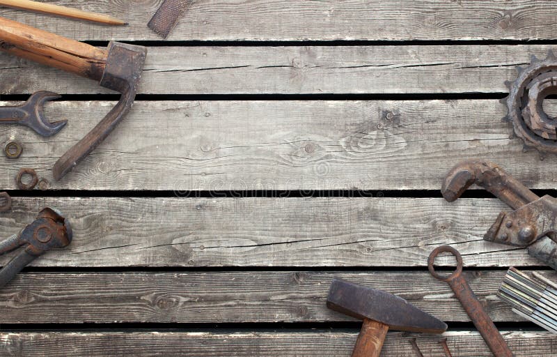 Old tools on wooden table with free space for text. Traditional handmade tools for craftsmen. Old tools on wooden table with free space for text. Traditional handmade tools for craftsmen.