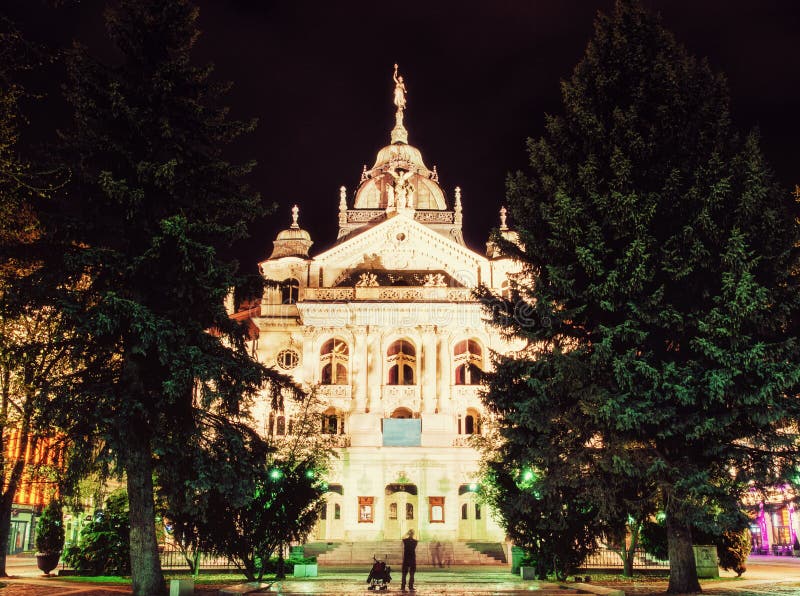 State theater in Kosice, Slovakia, night photo, yellow filter