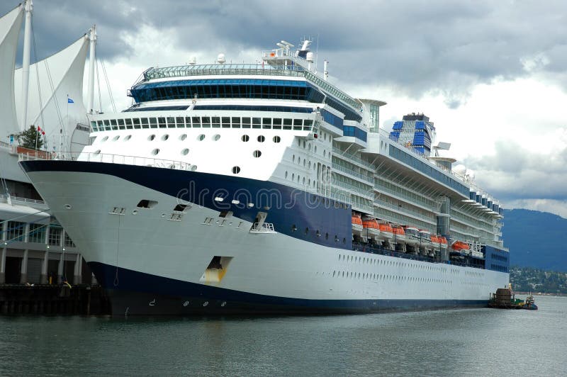 A cruise ship docked at berth at a ferry terminal. A cruise ship docked at berth at a ferry terminal