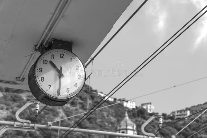 Station clock in mountain city, Sorrento Italy, time to ride, timetable of transport black and white royalty free stock photos Station clock in mountain city, Sorrento Italy, time to ride, timetable of transport black and white royalty free stock photos