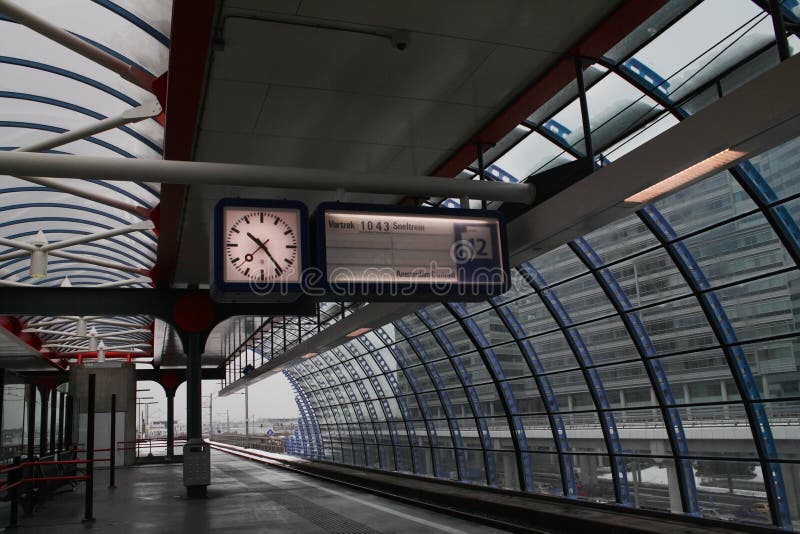 Clock in local high tech train station in Amsterdam. Clock in local high tech train station in Amsterdam