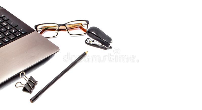 Stationary concept, Flat Lay top view Photo of laptop, pencil, stapled, paper clips, eyepieces, notes on white background with cop stock images Stationary concept, Flat Lay top view Photo of laptop, pencil, stapled, paper clips, eyepieces, notes on white background with cop stock images