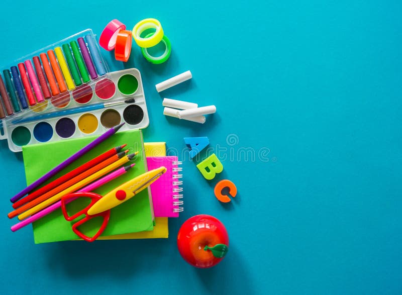 Stationery for study at school lies on blue. Back to school. Rainbow color.