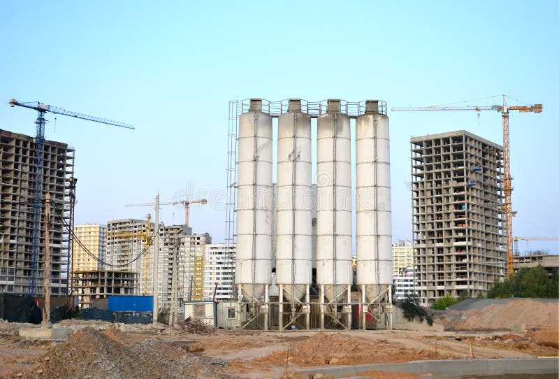 Stationary concrete batching plant on construction site. Producing сoncrete for construction and portland cement mortar. Stationary concrete batching plant on construction site. Producing сoncrete for construction and portland cement mortar