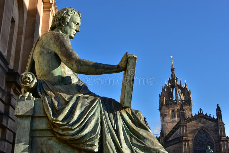 Statue of David Hume with St Giles` Cathedral in the background, Edinburgh, Scotland. Statue of David Hume with St Giles` Cathedral in the background, Edinburgh, Scotland