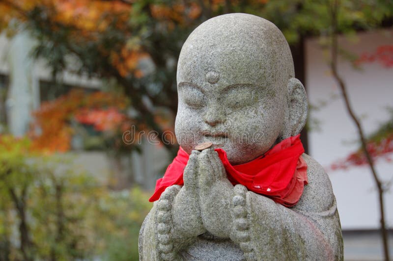 A statue of Jizo, the Buddhist child monk protector of children, travelers and women, Japan. A statue of Jizo, the Buddhist child monk protector of children, travelers and women, Japan