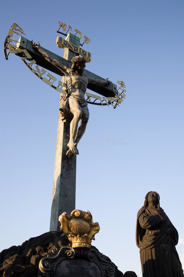 Sunset view on statuary of the Calvary Cross (Crucifix from 1629, statues by Emanuel Max 1861) standing on Charles Bridge. Sunset view on statuary of the Calvary Cross (Crucifix from 1629, statues by Emanuel Max 1861) standing on Charles Bridge.