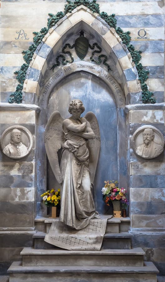 Statue of angel on an old tomb located in Genoa cemetery - Italy