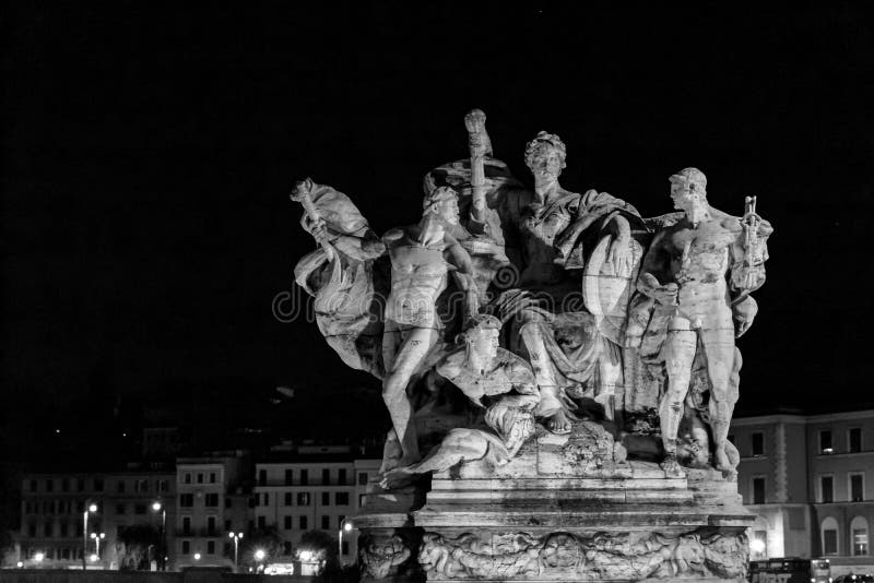 Statue on Bridge in Rome during Night with Lights. Stock Image Image