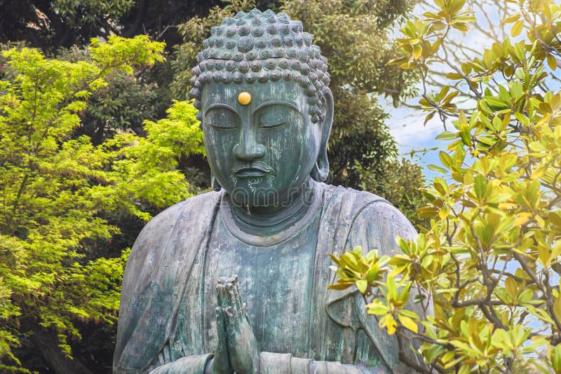 Statue of Buddha Shaka Nyorai praying in the Tennoji temple of Yanaka cemetery.