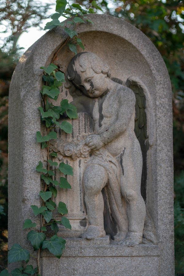 Statue of a Cherub on a Tombstone in Berlin Stock Photo Image of