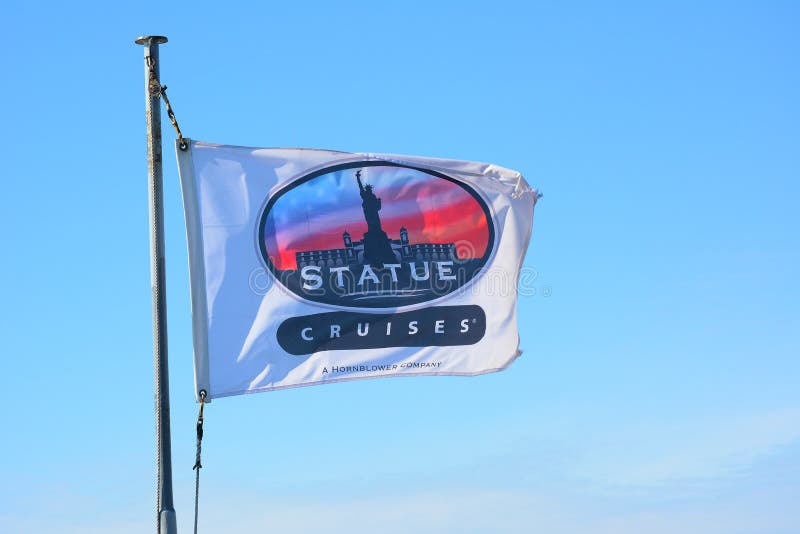 Statue Cruises flag atop the Miss Ellis Island, a ferry service that provid...