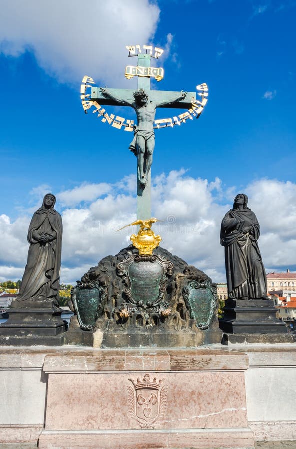 Prague, Czech Republic: Calvary statue, outdoor sculptures by Emanuel Max on the north side of Charles Bridge over the river Vltava. Prague, Czech Republic: Calvary statue, outdoor sculptures by Emanuel Max on the north side of Charles Bridge over the river Vltava.