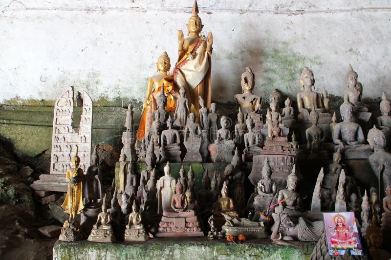 statues of buddha at the pak ou caves closed to luang prabang in laos. statues of buddha at the pak ou caves closed to luang prabang in laos