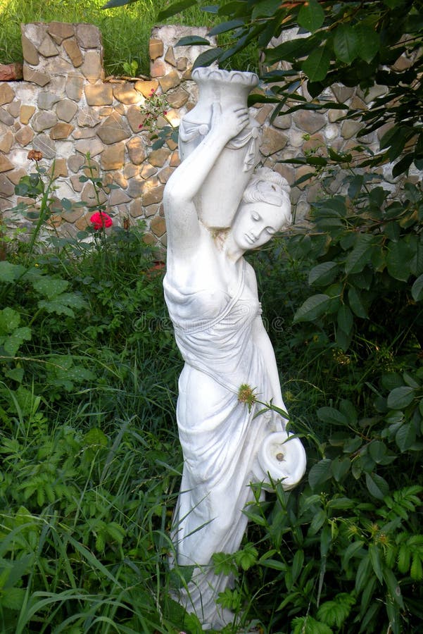 Statue in garden stock image. Image of beautiful, amity 50773395
